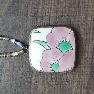 Ceramic pendant on beaded strap
